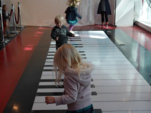 Tate, Ava and Lola getting crazy on the big piano.