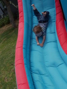 Knox flying down the slide.