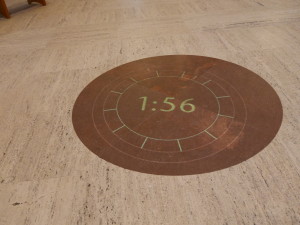 A light projected clock on the floor.
