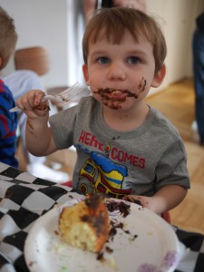 It isn't a birthday party with out a messy birthday boy cake photo!