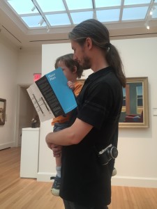 Knox reading the map of the art museum.